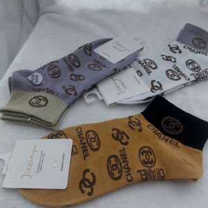 Women's Socks in Brown, White, and Gray size 7-9 you get all 3 pairs